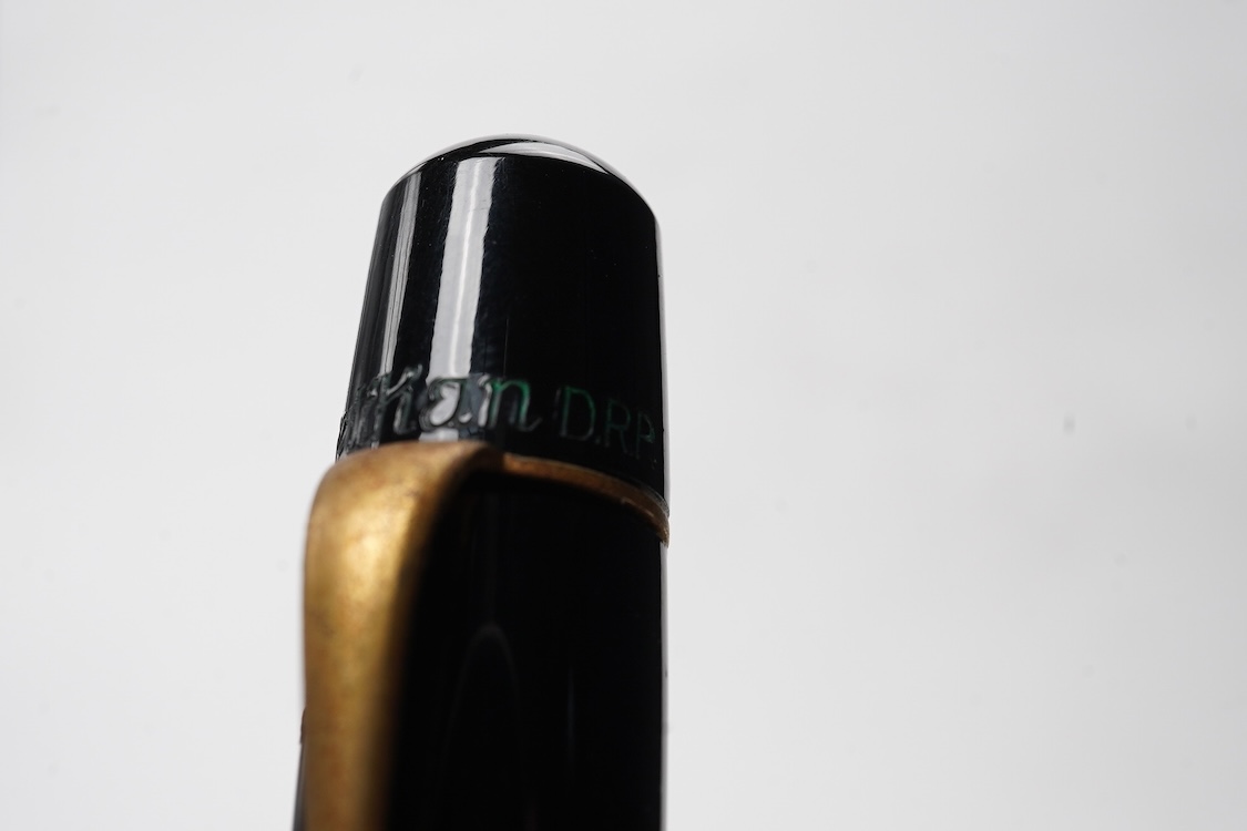 A Pelikan 100N fountain pen fitted with a 14ct. gold Pelkan nib